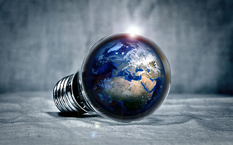 Lightbulb with earth within it. 